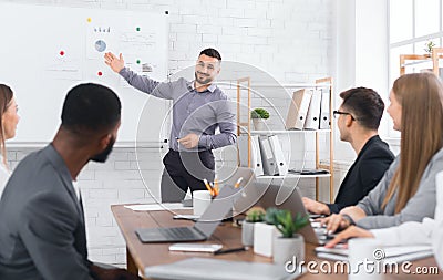 Successful businessman presenting diagrams on financial training Stock Photo