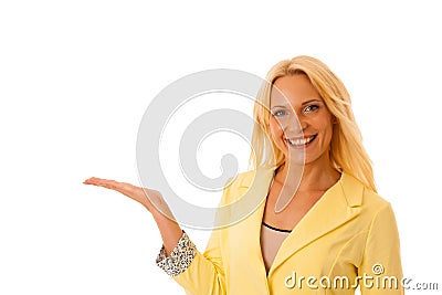 Business woamn adverts a product with her hand extended in copy Stock Photo