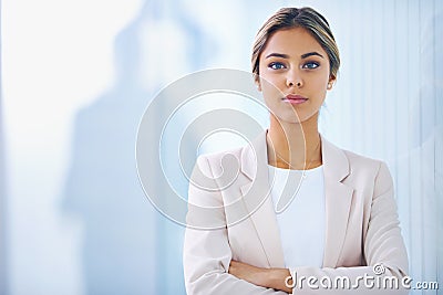 Business woman, arms crossed and serious in portrait, paralegal at law firm and confidence with pride. Young Stock Photo