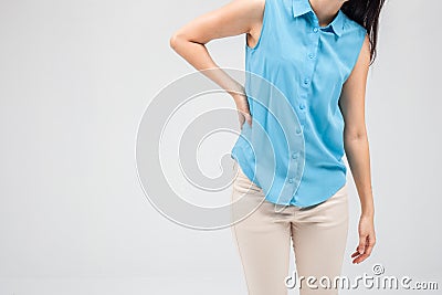 Business woman with back pain holding her aching hip Stock Photo