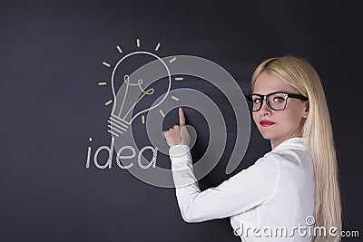 Business woman and big idea bulbs Stock Photo