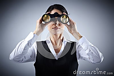 Business woman with binoculars. Stock Photo