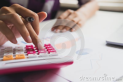 Business woman calculate about cost and doing finance at office Stock Photo