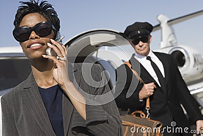 Business Woman On A Call At Airfield Stock Photo