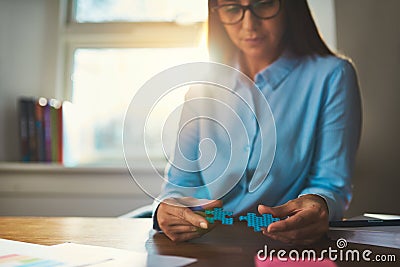 Business woman connecting puzzles Stock Photo