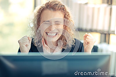 A business woman with curly blonde hair, raise hands, very happy, Stock Photo