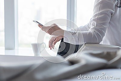 Business woman digital lifestyle using mobile smart phone working online via internet communication technology for emailing Stock Photo