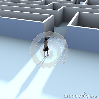 A business woman at the entrance to a maze Stock Photo