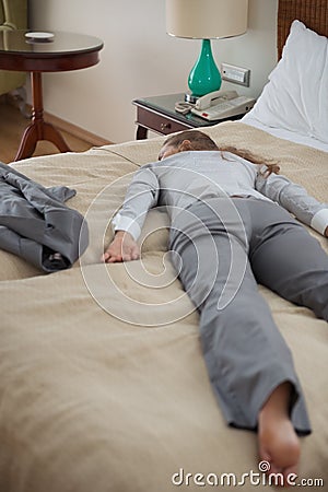 Business woman fall down from exhaustion in room Stock Photo