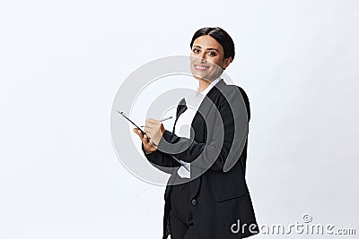 Business woman folder with documents in black business suit shows signals gestures and emotions on white background Stock Photo