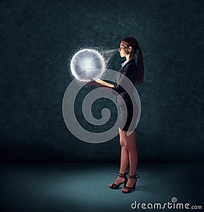 Business woman holding glowing planet earth Stock Photo