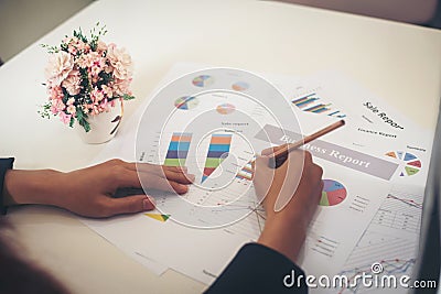 Business woman holding a pencil is working with. Stock Photo