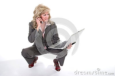 Business Woman Juggling Cellphone and Laptop 2 Stock Photo