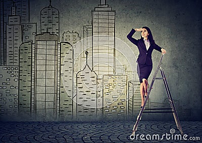 Business woman on a ladder looking far away forecasting real estate market Stock Photo