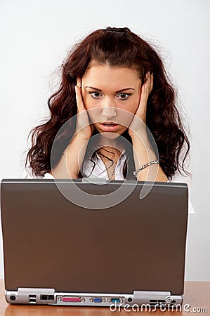 Business woman looking surprised to the screen Stock Photo