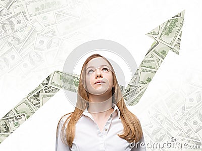 A business woman is looking up and thinking how to increase return of the business process. Stock Photo