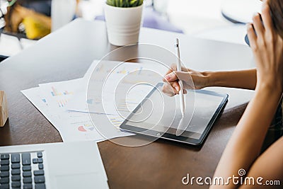 Asian Student female learning online course at cafe Stock Photo