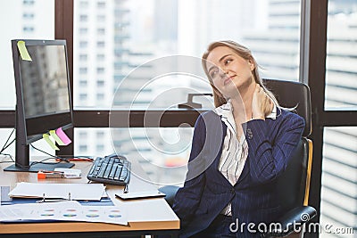 Business woman neck pain from longtime hard work in office Stock Photo