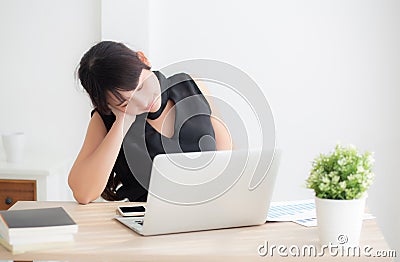 Business woman overwork on laptop computer and neck pain with at work in office Stock Photo