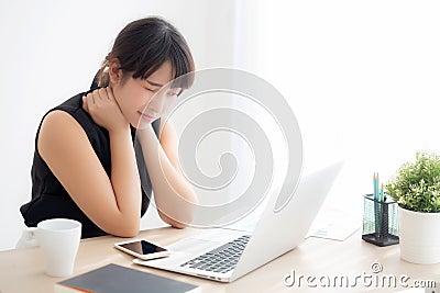 Business woman overwork on laptop computer and neck pain with at work in office, girl stress and illness chronic Editorial Stock Photo