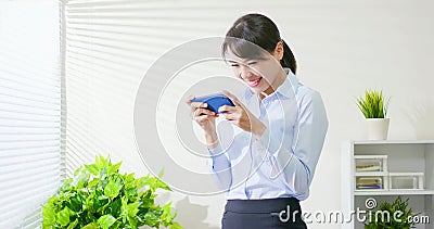 Business woman play mobile game Stock Photo