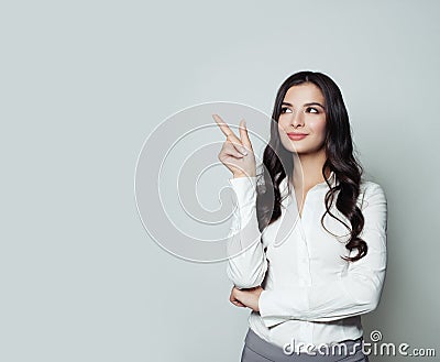 Business woman pointing her finger up Stock Photo
