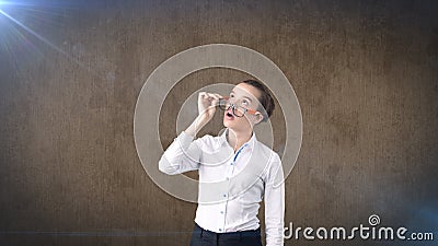 Business woman portrait in white skirt on isolated background. Model looking up with hair ban, orange and black glasses. Stock Photo