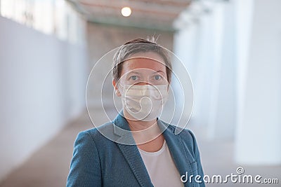 Business woman with protective face mask during Covid 19 pandemics Stock Photo