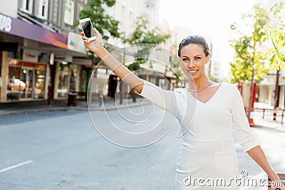 Business woman pulling suitcase bag walking in city Stock Photo