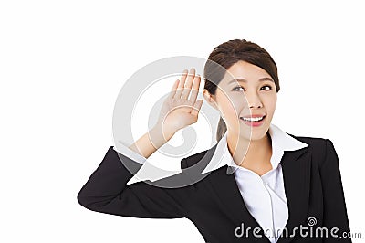 business woman putting hand to ear and listening Stock Photo