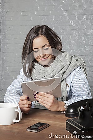 Business woman relaxes in the office, reads something on the int Stock Photo