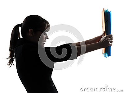 Business woman shielding behind folders files silhouette Stock Photo