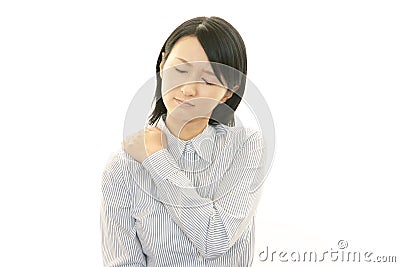 Business woman with shoulder pain. Stock Photo