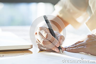 Business woman signing a contract document making a deal. Stock Photo