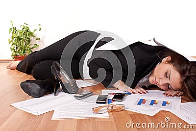 Business woman sleeping on floor Stock Photo