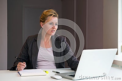 Business woman taking notes Stock Photo