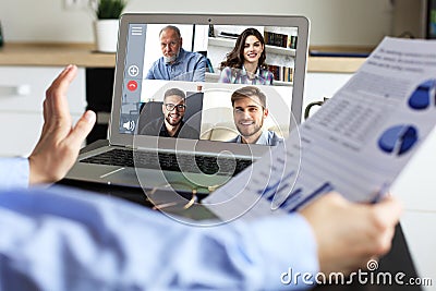 Business woman talking to her colleagues in video conference. Business team working from home using laptop Stock Photo