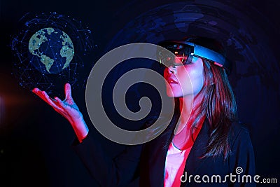 Business woman try vr glasses hololens in the dark room | Portrait of young asian girl experience ar | Future technology concept Stock Photo