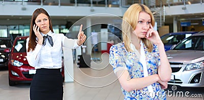 Business woman trying to calm down dissatisfied customer woman Stock Photo