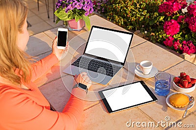 Woman using different tech devices Stock Photo