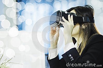 Business Woman using a VR headset for work with virtual reality, with fun and happy new experience, Concept of modern technologies Stock Photo