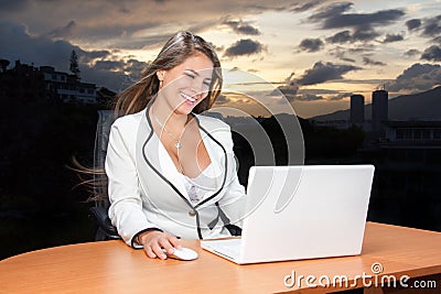 Business woman very happy looking laptop in the sunset Stock Photo