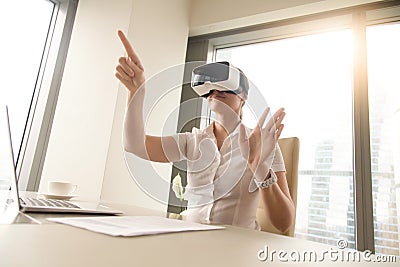 Business woman wearing virtual reality glasses Stock Photo