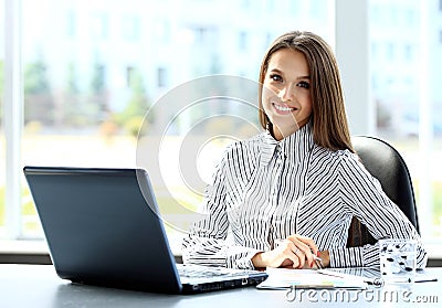 Business woman working on laptop computer Stock Photo