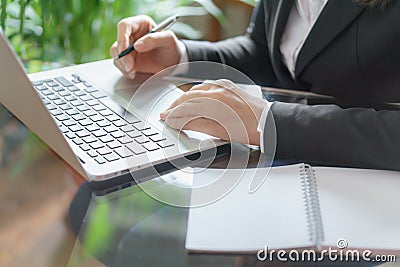 Business woman working with laptop, copybook and pen. Stock Photo