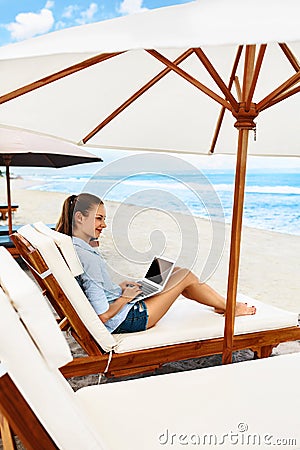 Business Woman Working Online On Beach. Freelance Computer Internet Stock Photo