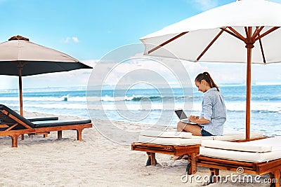 Business Woman Working Online On Beach. Freelance Computer Internet Stock Photo