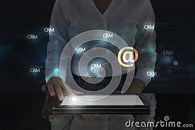 Business woman works on digital screen about Crm and e-mail Stock Photo