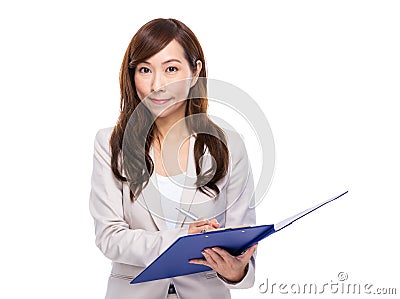 Business woman write something on file pad Stock Photo