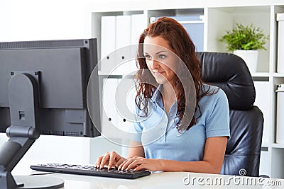 Business woman writing on a computer Stock Photo